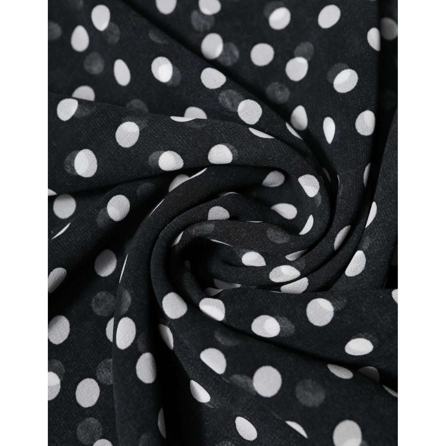 Close-up of Dolce & Gabbana black polyester scarf with white polka dots, showcasing fabric texture and elegance.