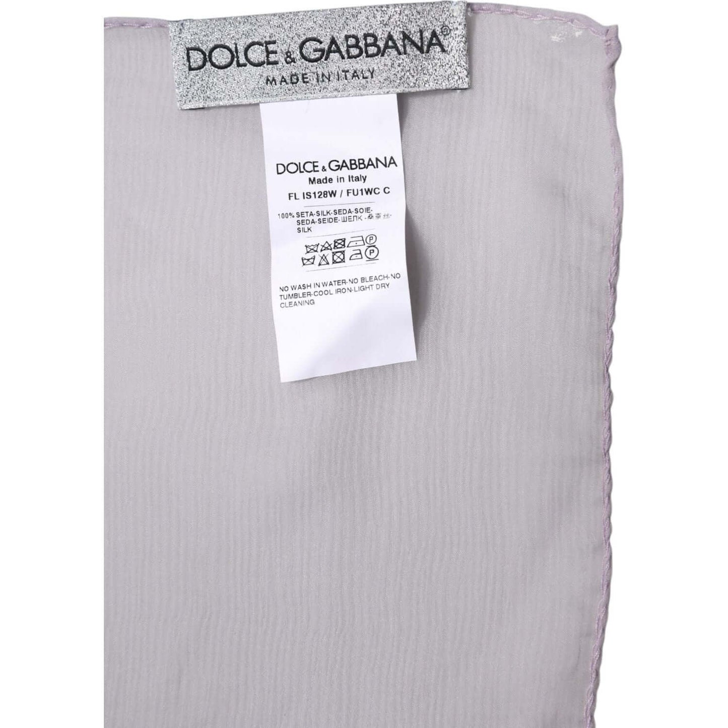 Dolce & Gabbana purple silk wrap shawl scarf with label showing authenticity, made in Italy, 100% silk, luxury fashion accessory.