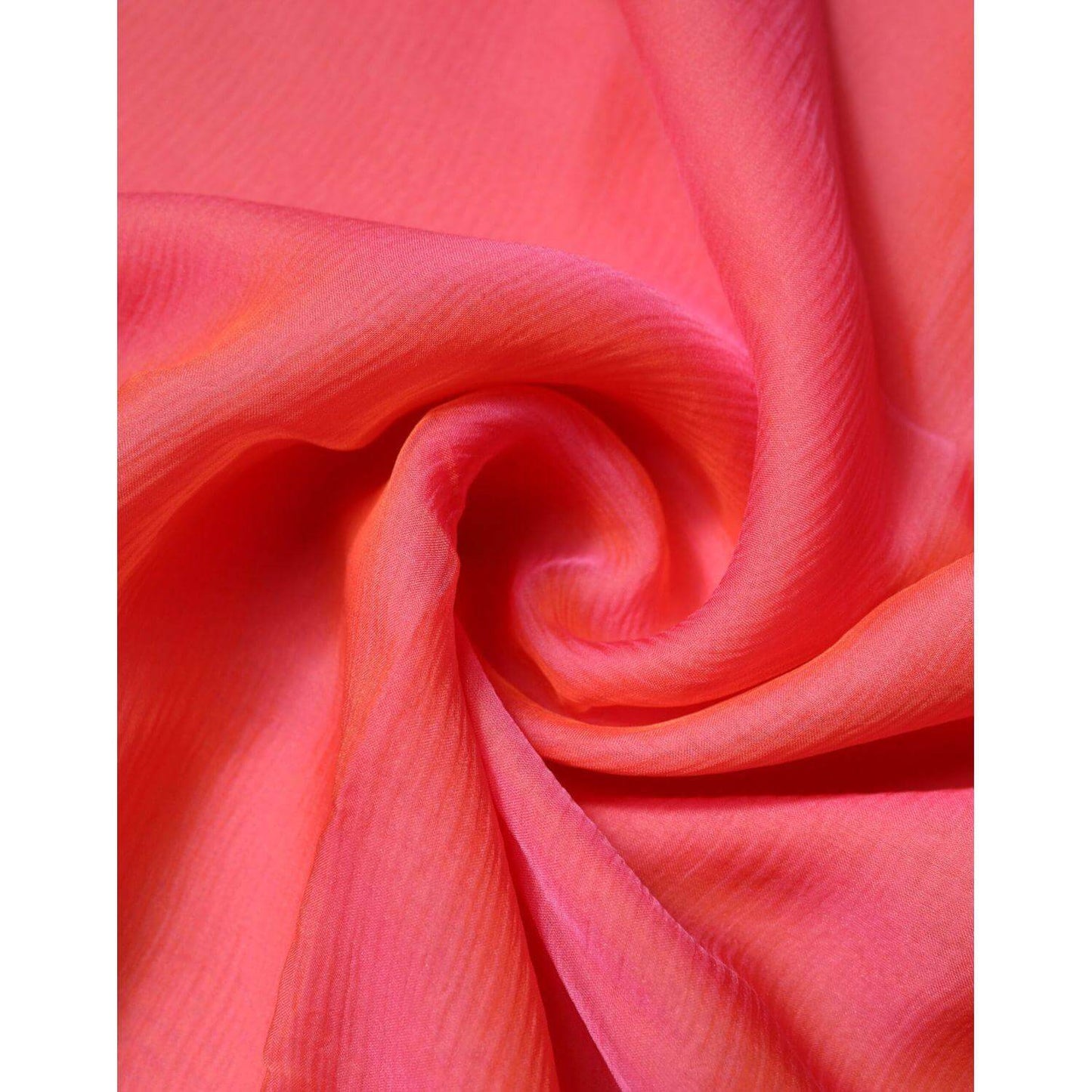Close-up of luxurious Dolce & Gabbana pink silk women's wrap shawl scarf, showcasing soft texture and vibrant color. Made in Italy.