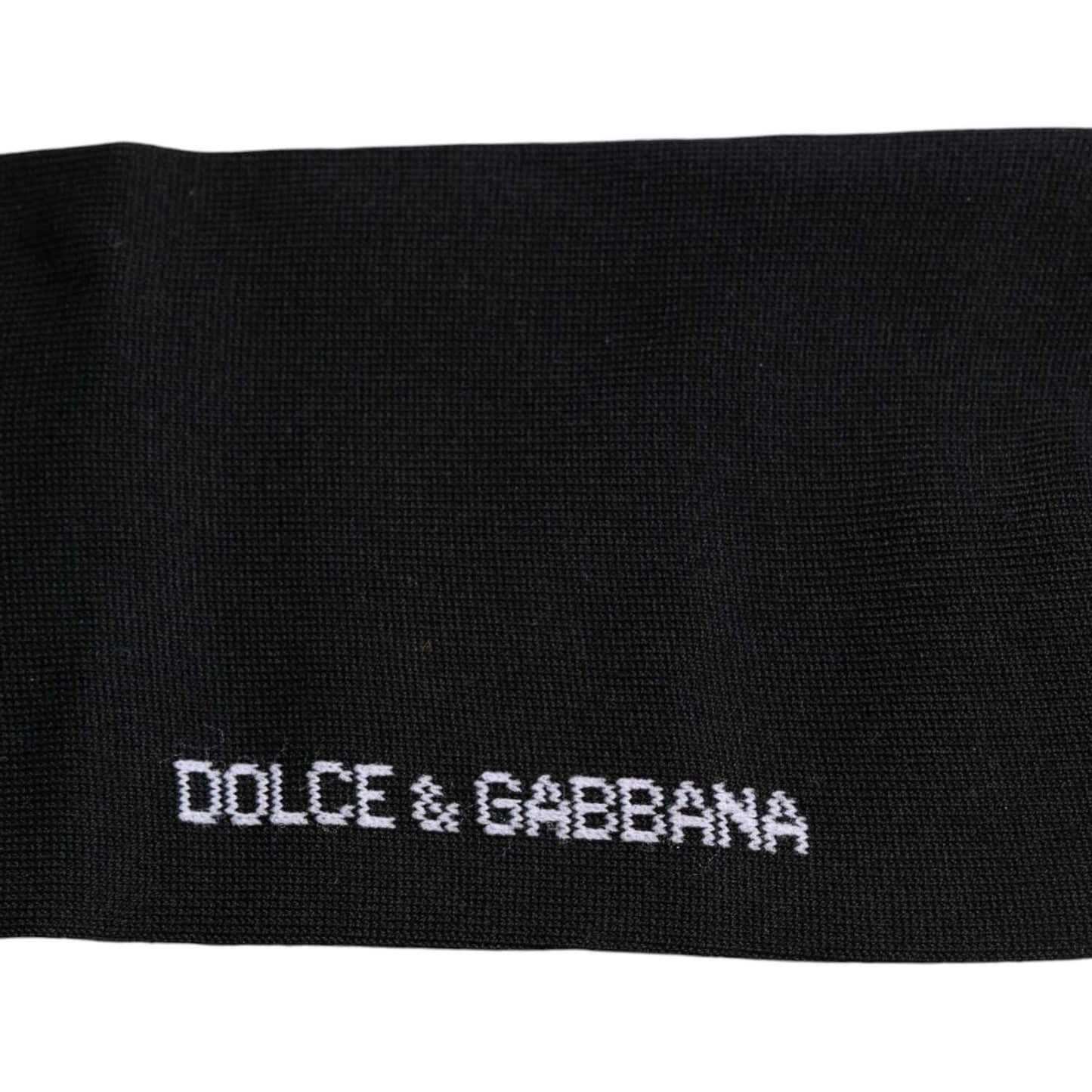 Dolce & Gabbana black over calf socks with white logo print made of cotton, nylon, and elastane for unisex. Made in Italy.
