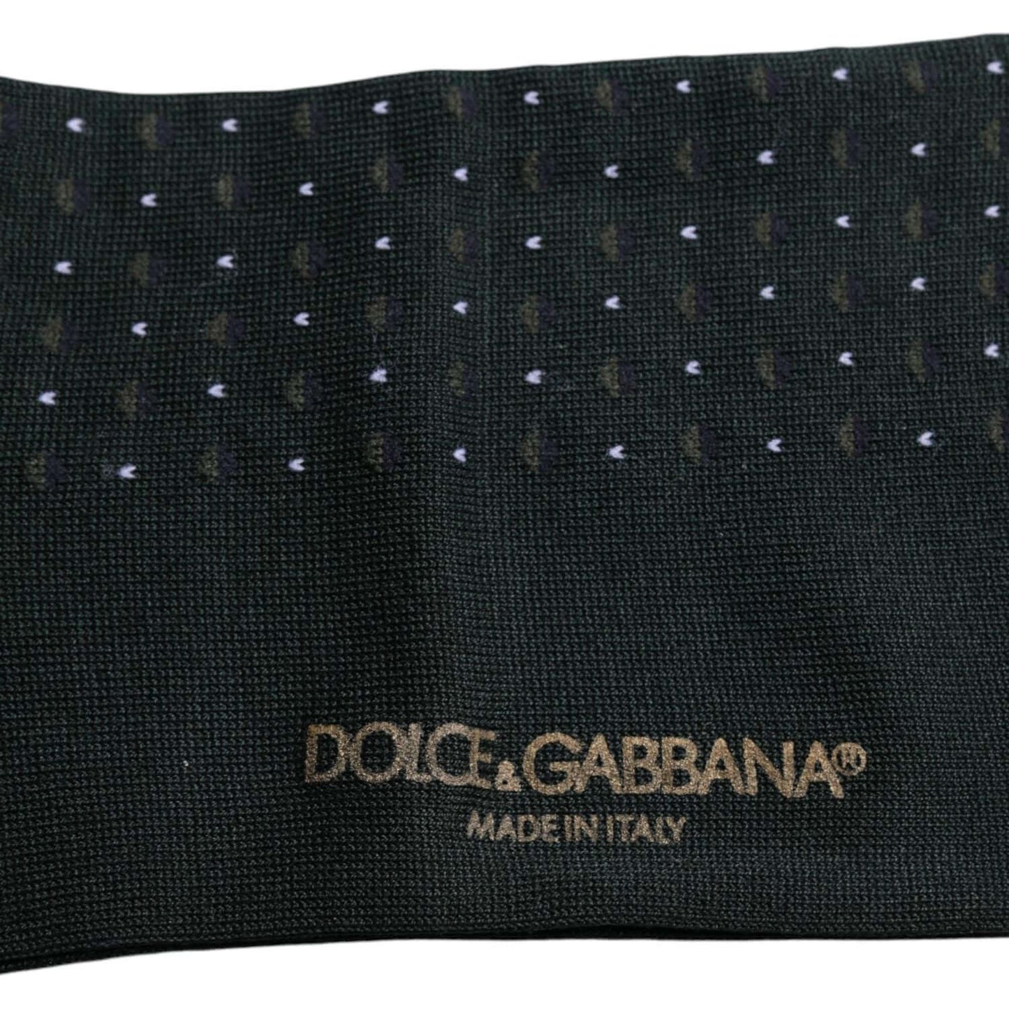 Dolce & Gabbana black polka dot cotton mid calf socks with gold logo, showcasing detailed texture and Made in Italy branding.