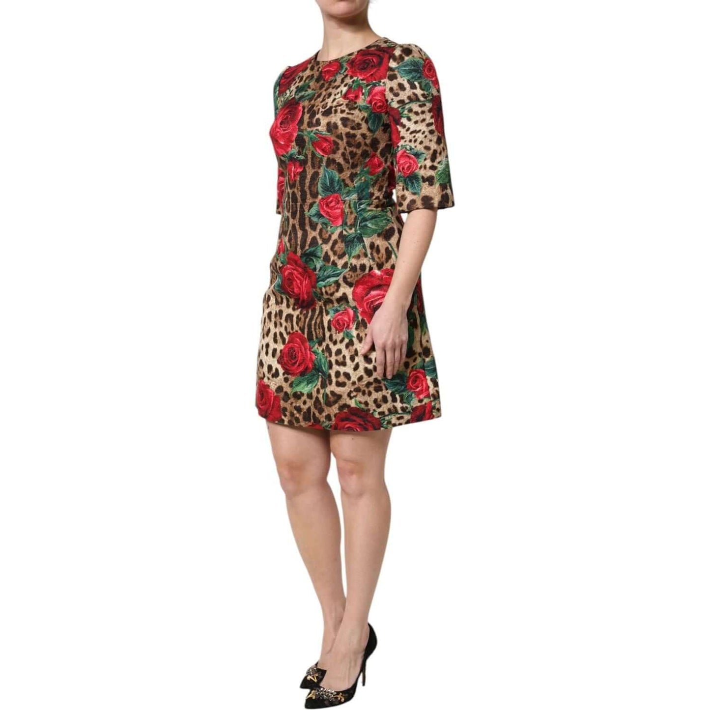 Dolce & Gabbana brown leopard print mini dress with red rose floral motif and short sleeves, modeled on a woman.