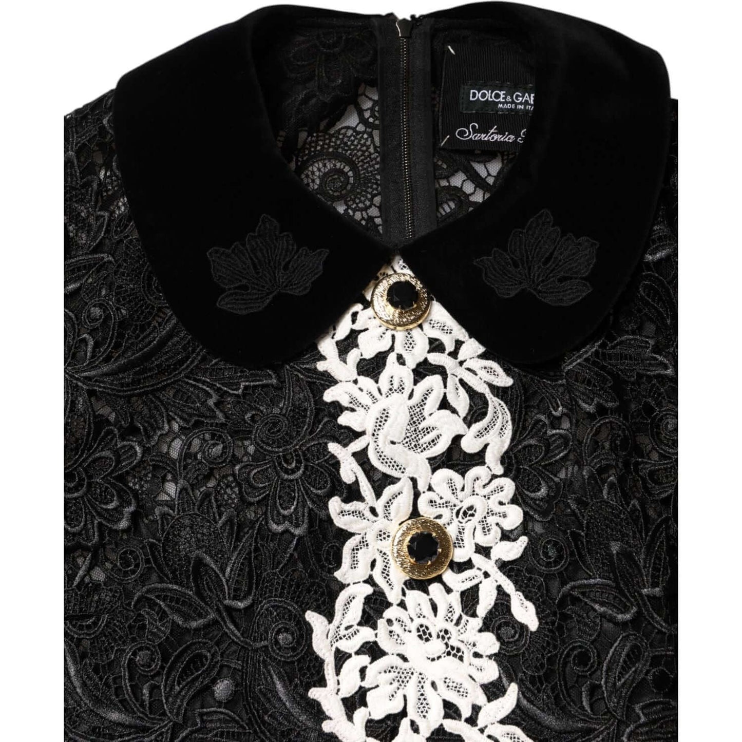 Close-up of Dolce & Gabbana black floral lace embellished mini dress with ornate buttons and collar detailing.