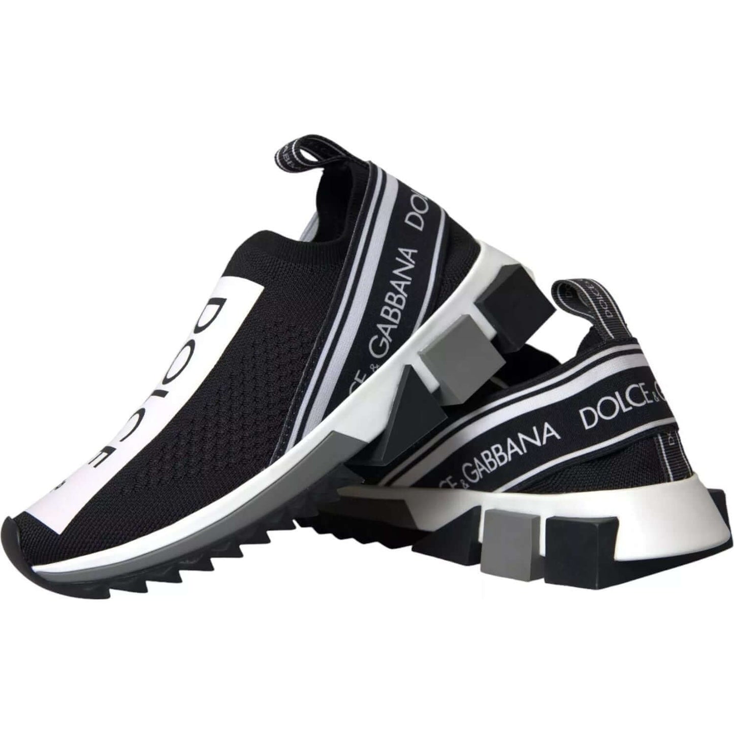 Dolce & Gabbana Sorrento black and white slip-on sneakers with logo print and pull strap, featuring a black decorative rubber sole.