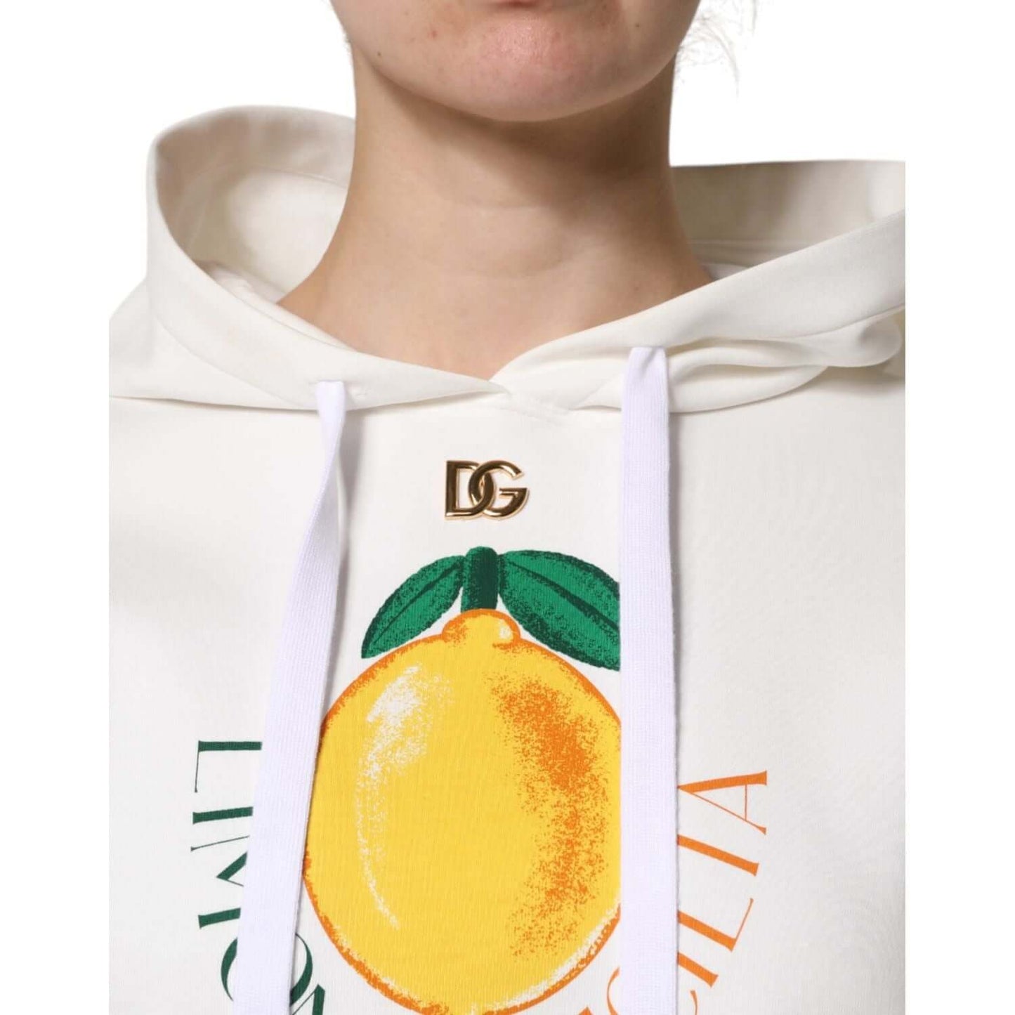 Dolce & Gabbana ivory hooded sweater with lemon print and logo detail, made of cotton and polyester, close-up of design.