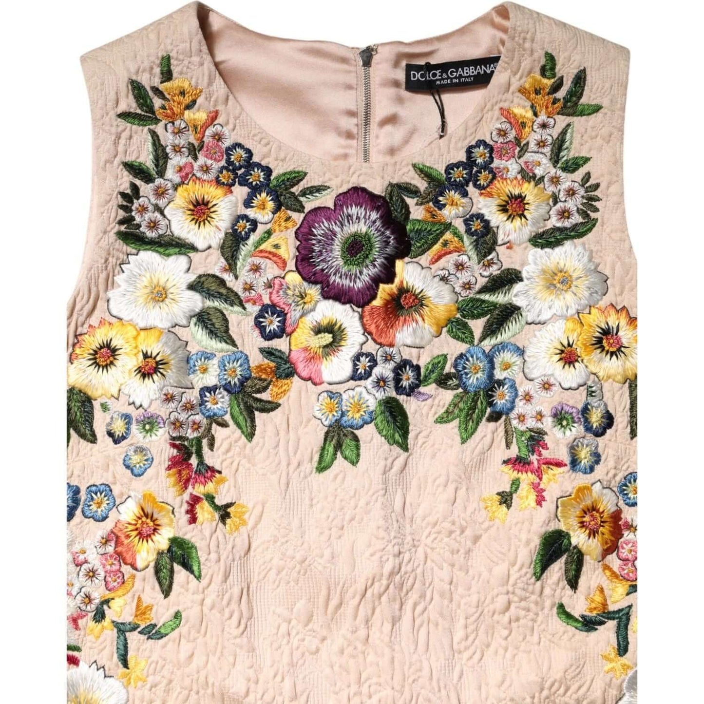 Dolce & Gabbana beige sleeveless tank top with floral embroidery, made of cotton and nylon, zipper closure, logo detail.
