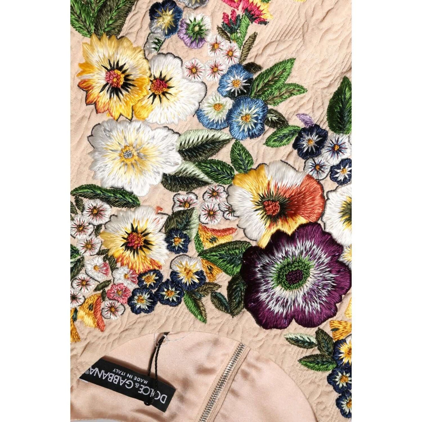 Dolce & Gabbana beige sleeveless tank top with floral embroidery and zipper, made in Italy, showcasing luxury craftsmanship.