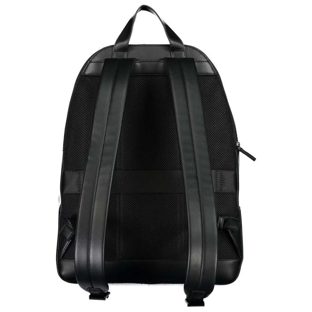 Back view of Tommy Hilfiger Chic Urban Traveler Backpack showing adjustable straps and handle in elegant black design.
