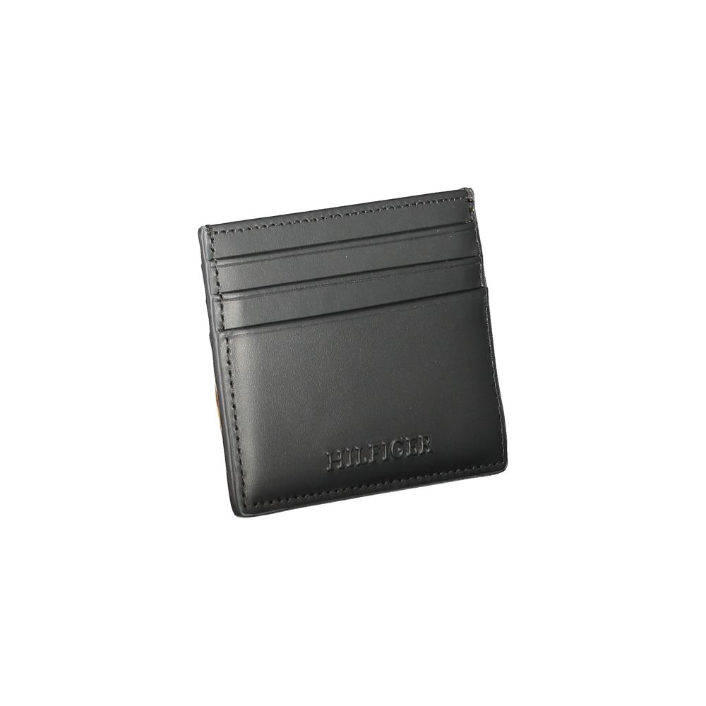 Tommy Hilfiger Black Leather Wallet with card holder, central pocket and logo, featuring contrast details and spaces for cards.