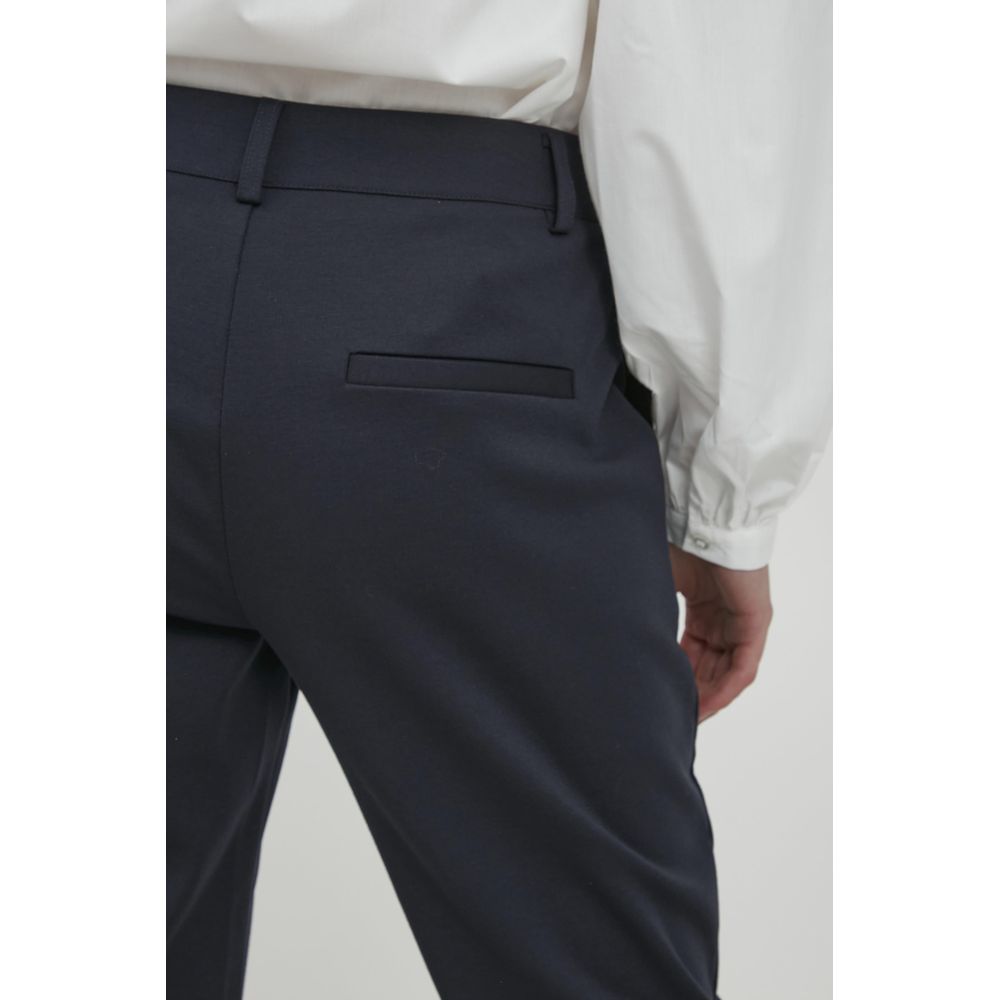 Close-up of ICHI Blue Recycled Polyester Dress Pants showcasing tailored fit and rear pocket detail