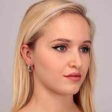 Woman wearing LA PETITE STORY JEWELRY Mod. LPS02ARQ182 earrings showcasing elegant design.