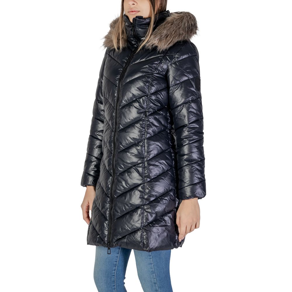 Woman wearing Only Black Polyamide Coat with faux fur hood and diagonal quilting