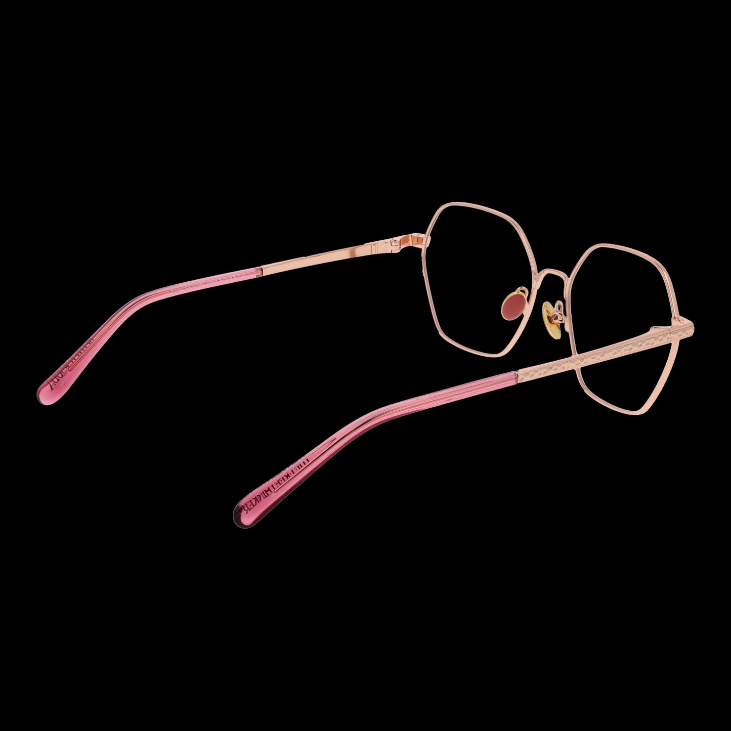 SCOTCH & SODA MOD. SS1025 53401 eyeglasses for lady with hexagonal lenses and pink temples on a black background.