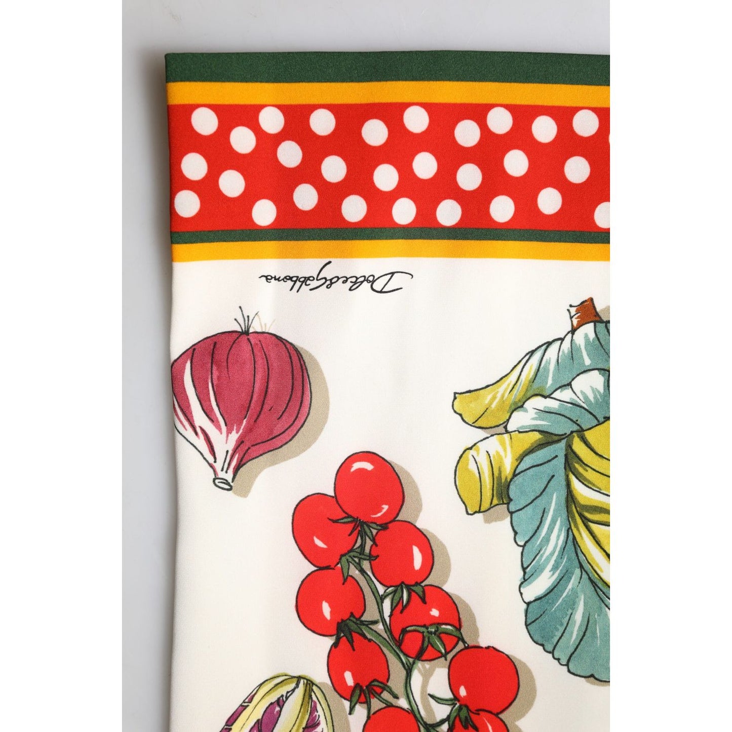 Dolce & Gabbana multicolor midi skirt with vegetable and polka dot print, featuring branded signature and high-quality silk material.