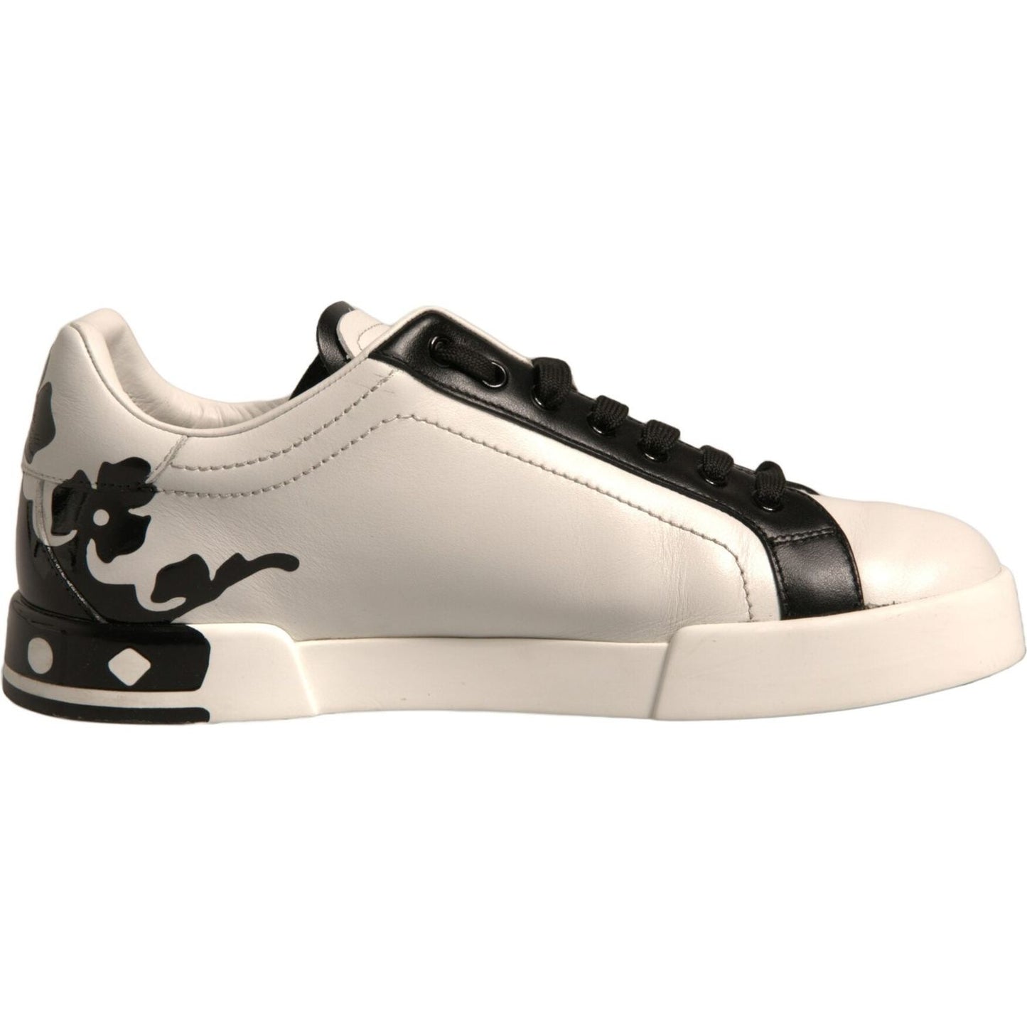 Dolce & Gabbana white black leather Milano sneakers with crown detail, side view.