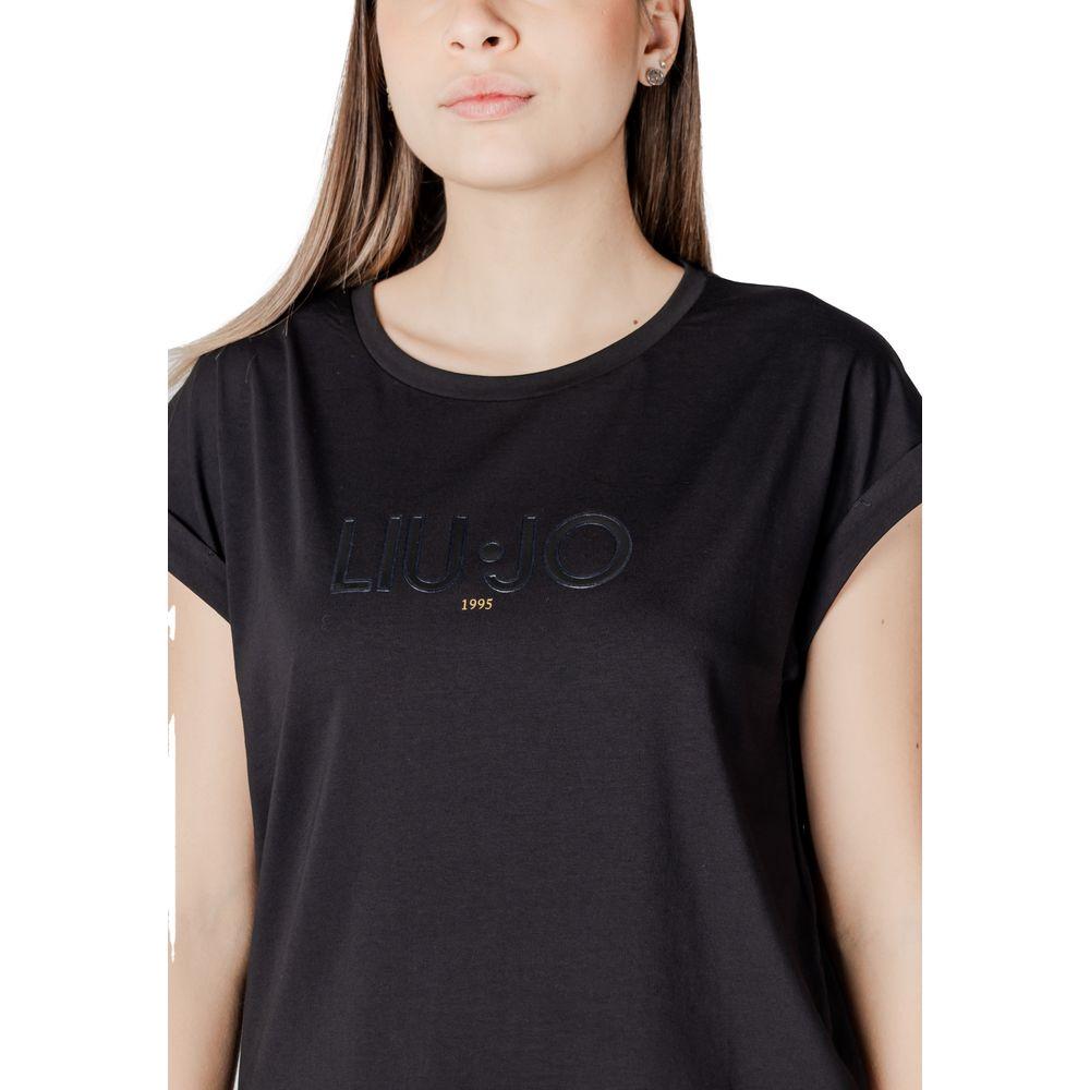 Woman wearing Liu Jo black cotton t-shirt with short sleeves, featuring subtle logo design for casual and elegant look.