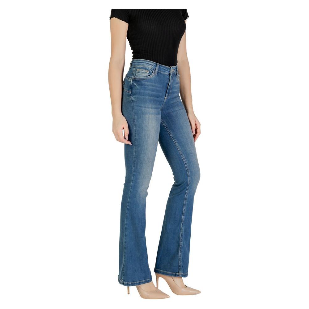 Woman wearing Liu Jo blue bootcut jeans, cotton blend, high waist, flared design for modern casual style.