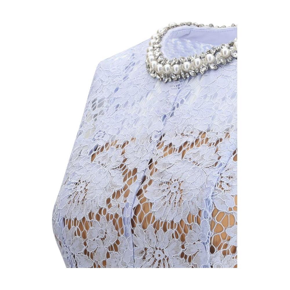 Close-up of Self-Portrait lace midi dress with floral pattern, pearl and jewel choker.