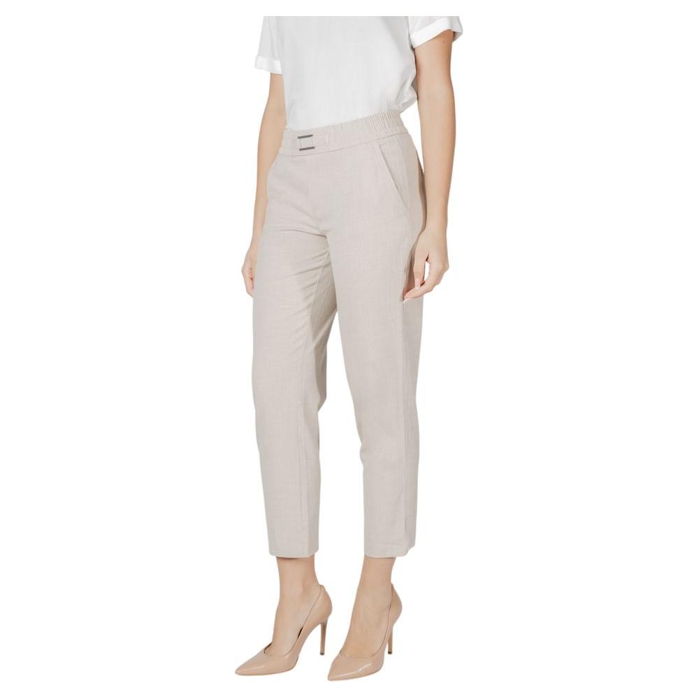 Woman wearing Street One beige viscose trousers with buckle belt, stylish and versatile for everyday wear.