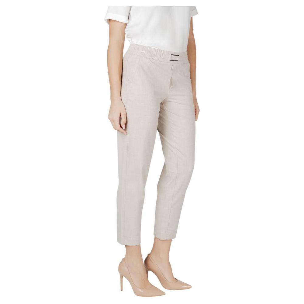 Woman wearing Street One Beige Viscose Jeans with Buckle Belt, featuring a stylish and versatile design perfect for everyday wear.