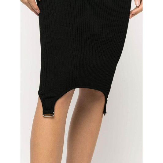 Black ribbed knit halterneck dress with ring hardware detailing, featuring a below-knee length and open back design.