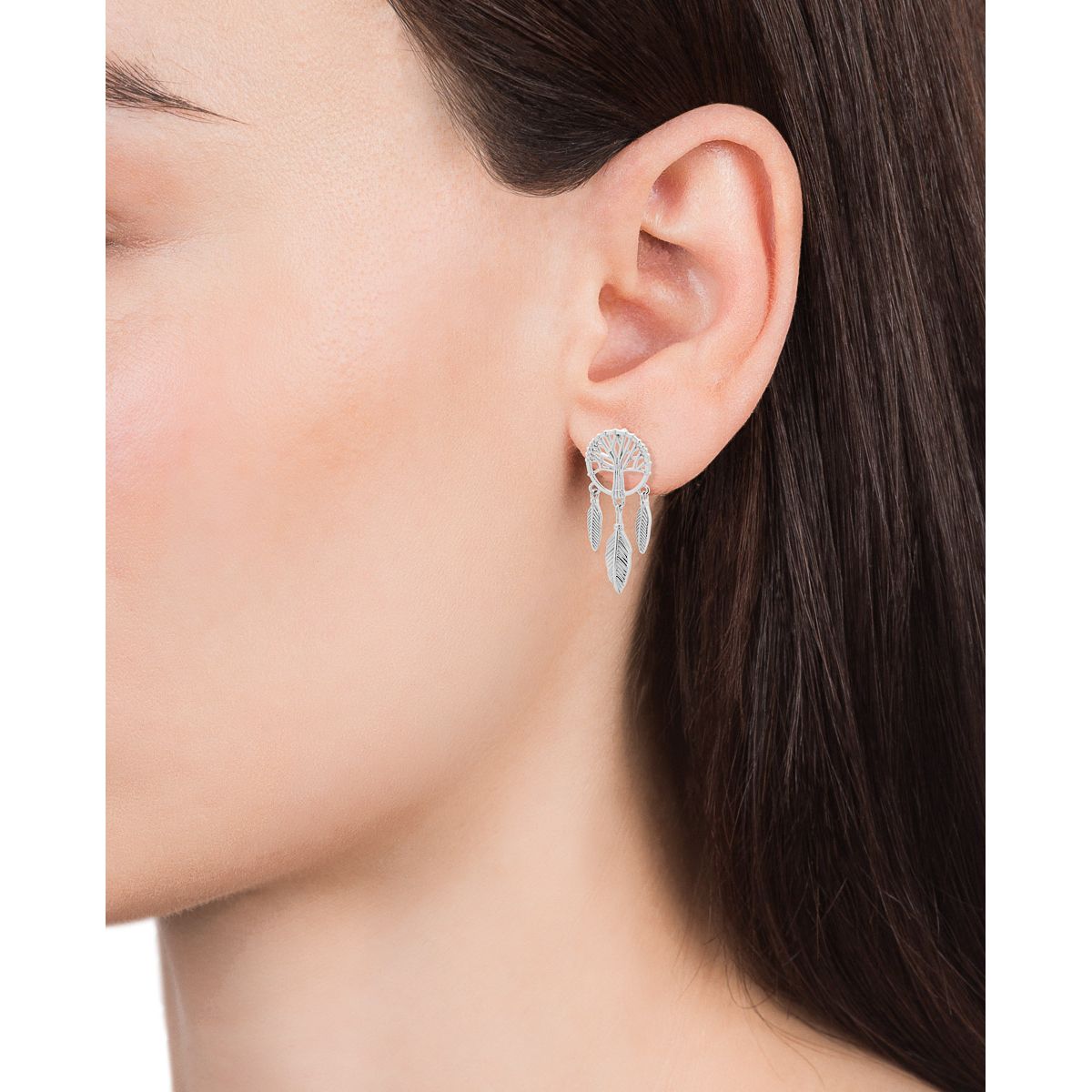 Woman wearing VICEROY JEWELS Mod. 13048E000-00 silver earrings, showcasing intricate design and elegance, suitable for ladies, 5 ATM resistant.