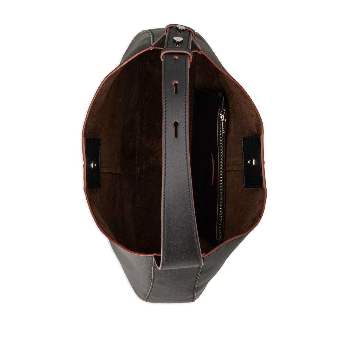 Front view with bag zipped and handles upright.