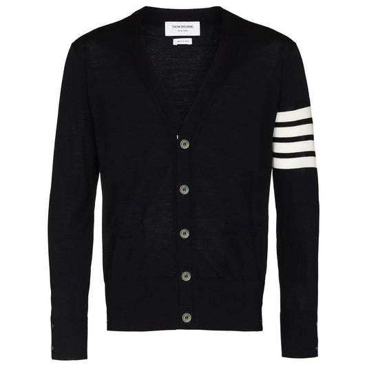 Navy blue Thom Browne sweaters with button fastening and 4-Bar stripe design, featuring side slits and long sleeves.
