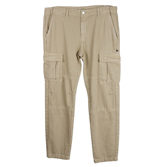 Comme Des Fuckdown beige cotton men's trousers with oversized cargo pockets, made in Italy. Streetwear fashion statement in a neutral color.