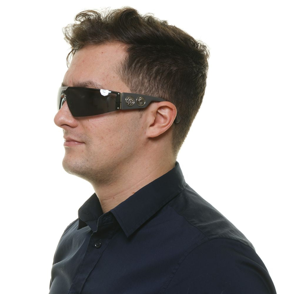 Man wearing Roberto Cavalli Black Metal & Plastic Sunglasses with grey lenses and rimless design, showcasing side view.