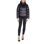 Woman wearing Peuterey Black Polyamide Jackets & Coat with quilted design and adjustable hood.