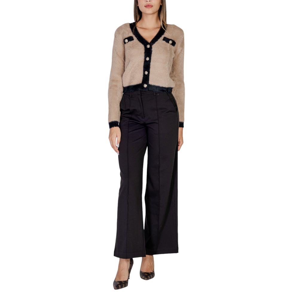 Woman wearing ICHI Black Polyester Pant with buttoned cardigan
