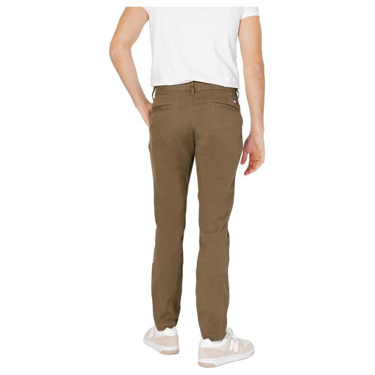 Men's green Tommy Hilfiger tapered pants made from 96% organic cotton, 4% elastane; perfect for spring summer fashion.