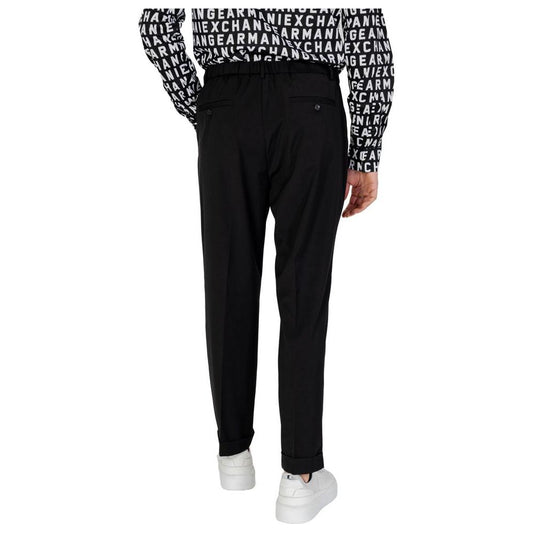 Model wearing Antony Morato black polyester jeans and pants, spring/summer collection, back view, casual style with white sneakers.