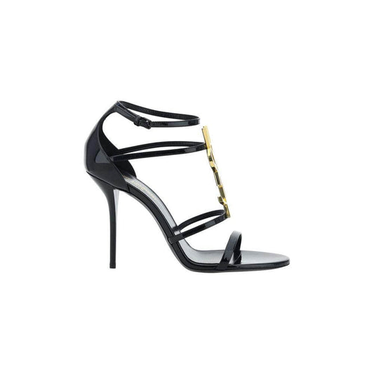 Saint Laurent Cassandra Sandals in calfskin with YSL logo, open front round toe, adjustable ankle strap, and stiletto heel, cage style.