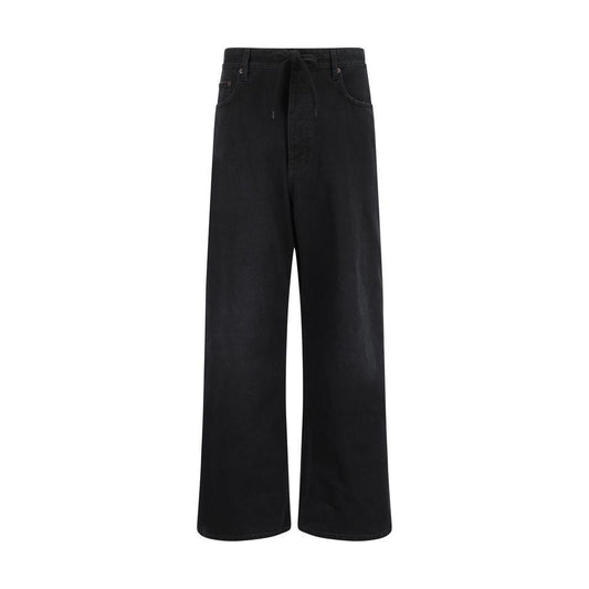 Balenciaga baggy jeans in black denim, featuring an oversized silhouette, classic five-pocket design, and signature back patch.