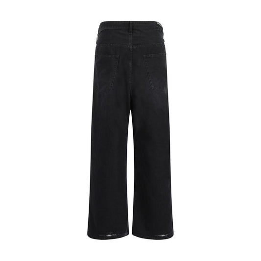 Back view of Balenciaga baggy jeans in black with oversized silhouette and signature patch, featuring five-pocket design and belt loops.