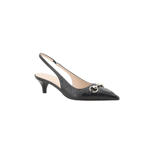 Gucci Horsebit leather pumps with slingback and kitten heel, featuring classic design and iconic horsebit detail.