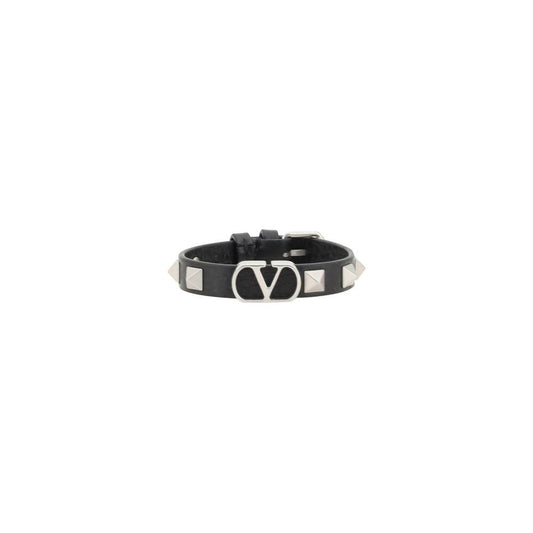 Valentino Garavani Vlogo Bracelet in black leather with Rockstud accents, featuring iconic logo and adjustable buckle.