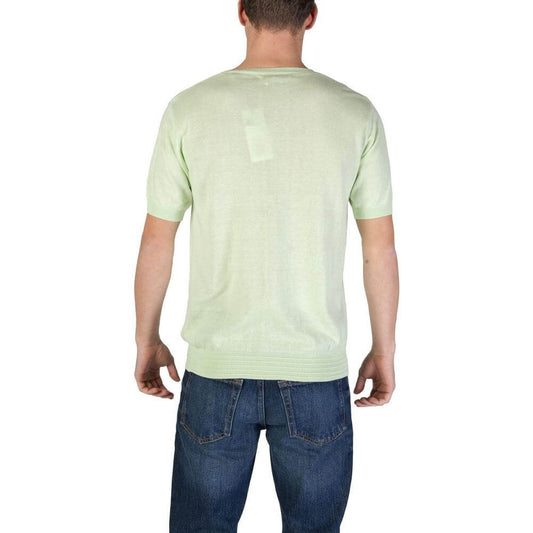 Back view of a man wearing a Hamaki-Ho Green Cotton T-Shirt from the men's fall/winter collection, paired with jeans.