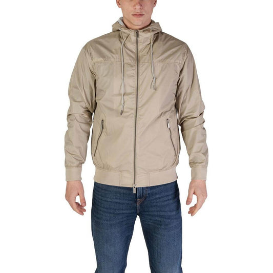 Man wearing a Hamaki-Ho beige nylon jacket, fall/winter collection, 100% nylon, men's fashion.