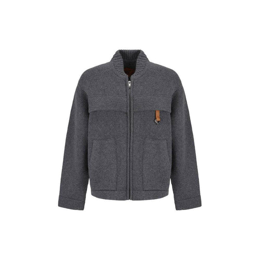 MCM Collection wool cardigan with ribbed crew neck, double-slider zipper, and two front pockets in a monochrome design.