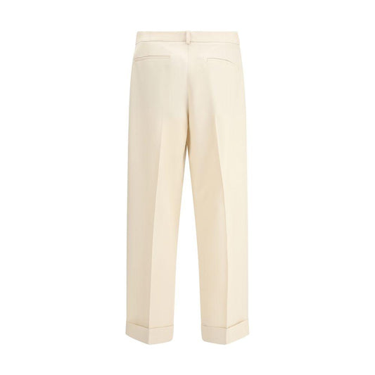 Back view of Valentino virgin wool wide-leg pants with welt pockets and turned-up hem.