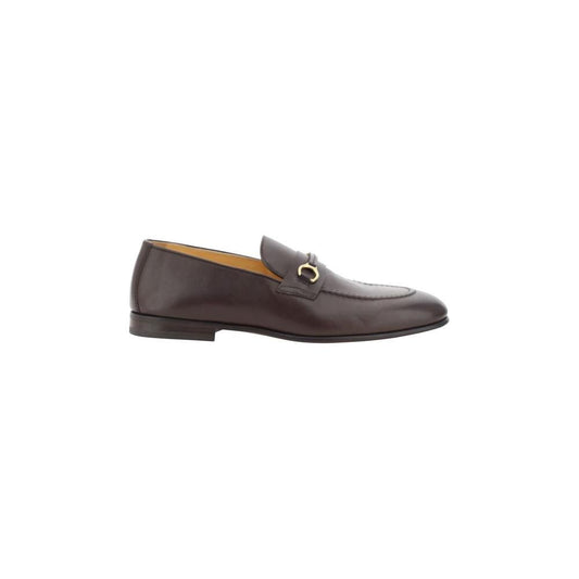 Brunello Cucinelli leather loafers with almond toe, leather block heel, and antiqued brass detail, shiny design side view.