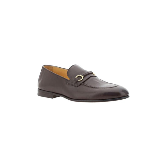 Brunello Cucinelli leather loafers with almond toe and brass detail, featuring a block heel and shiny design.