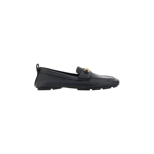 Versace leather driver loafers with metallic Medusa head, Greca motif, black hammered finish, side view.