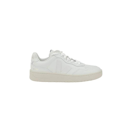 Veja V-90 sneakers in organic leather with a minimalist design, featuring a round toe and lace-up closure. Iconic V logo on the side.