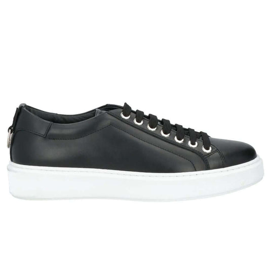Les Hommes black calfskin men sneaker with silver logo tongue, decorative metal ring, and white rubber sole.