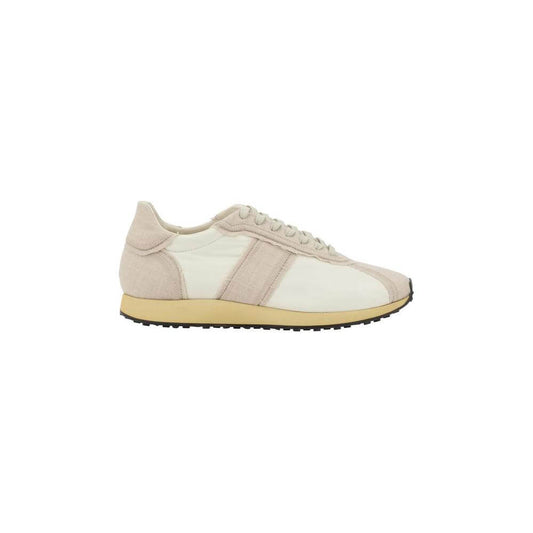 The Row Moveo Sneakers with lace-up closure, paneled design, flat sole, and reinforced toe for comfort, style, and durability.
