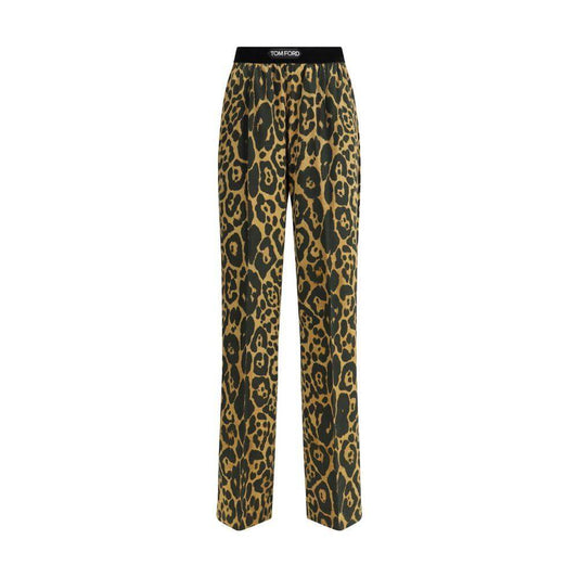 Tom Ford silk pants with animal print, elastic waistband, side welt pockets, and back patch slit pockets, combining elegance and comfort.
